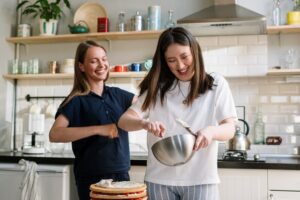 Two friends baking together