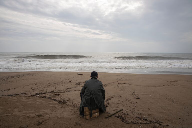 Man watching the ocean